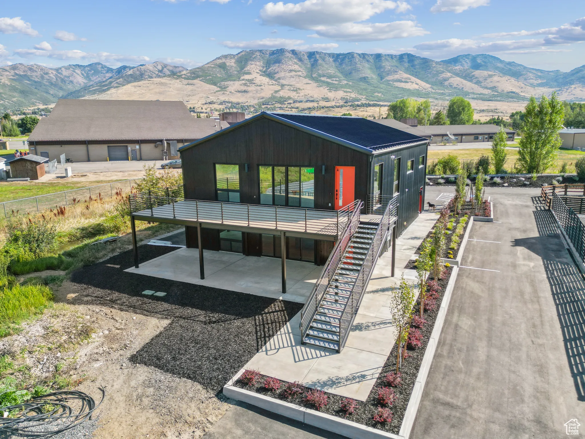 Rear view of house featuring a mountain view