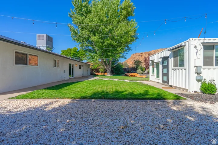 View of yard with central AC