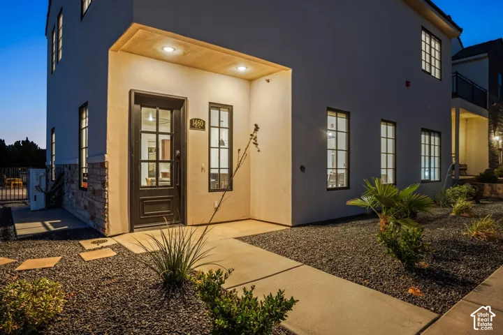 The front entry at twilight, steps from the off-street parking.