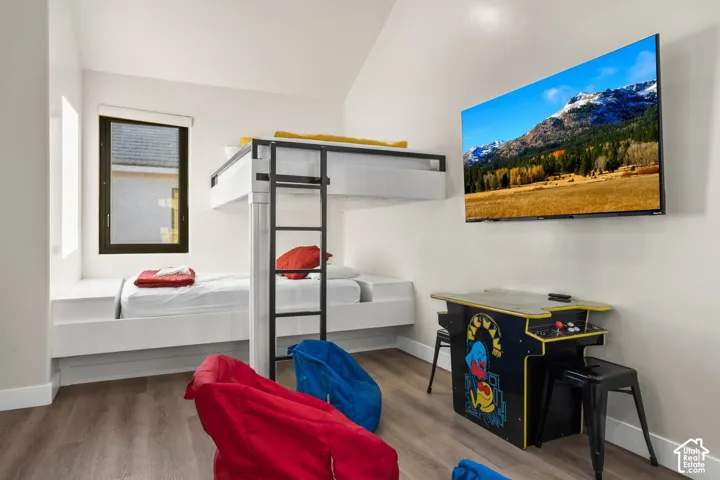 An arcade cabinet and TV in the bunk room keep the games going.