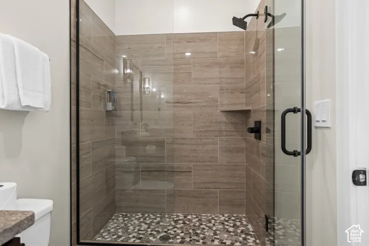 A walk-in tile shower with built-in niches.