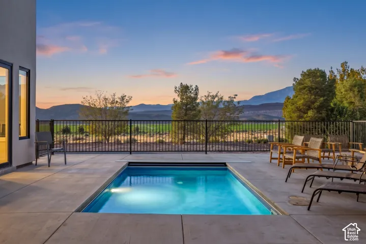 The open, heated private pool looks out to Pine Valley Mountain, one of the few homes in the resort with this view.