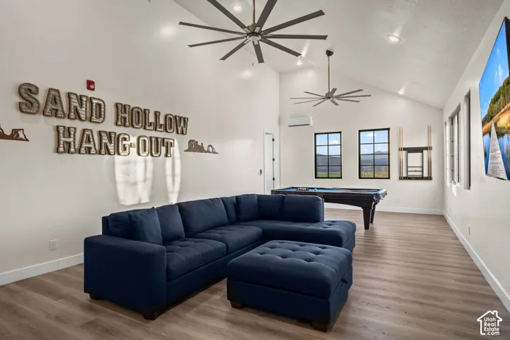 The Sand Hollow Hang-Out: a 38-foot upstairs recreation room with a big sectional and the pool table just beyond.