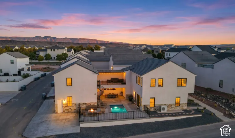Overhead view of the home, its heated private pool, and the covered upper deck.