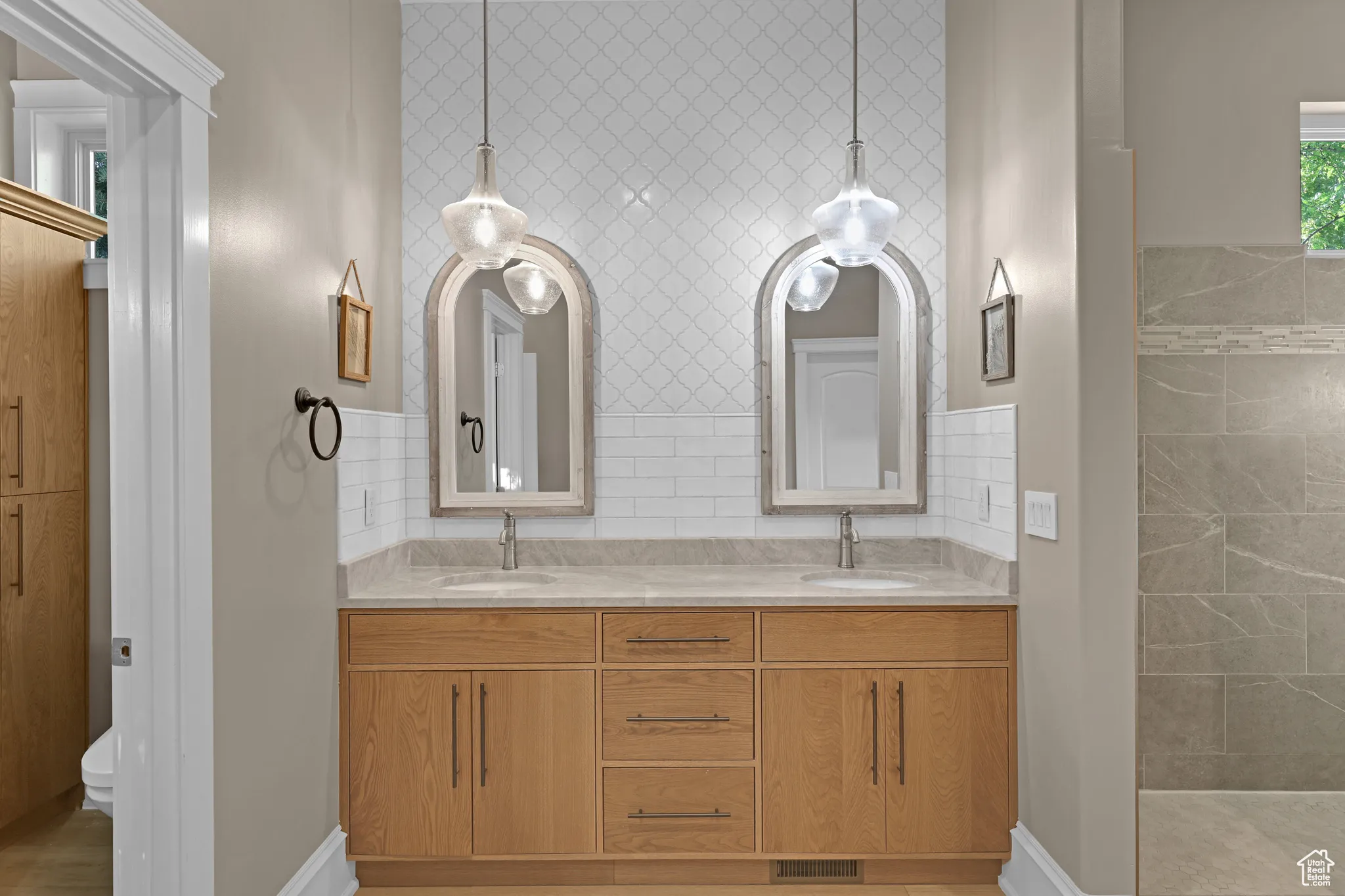 Bathroom with vanity, a shower, and toilet