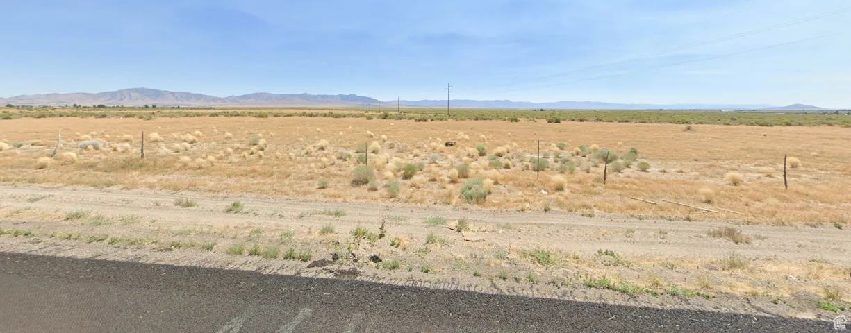 Property view of mountains with a rural view