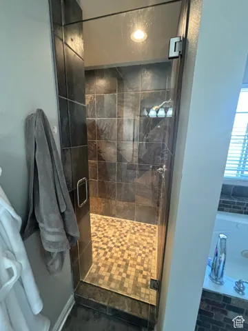Primary Bathroom featuring walk in shower