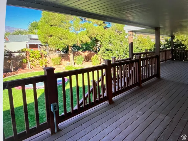 Covered Deck featuring a lawn