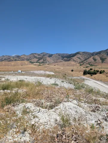 View of mountain background featuring rural landscape