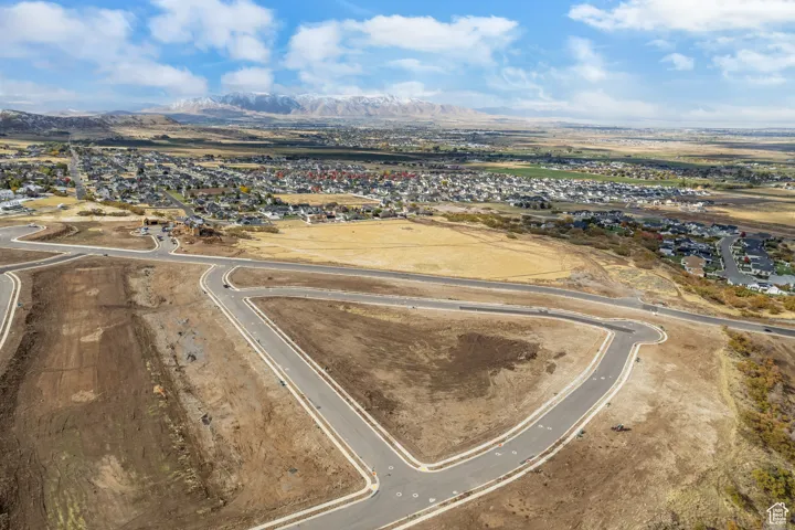 Birds eye view of property with a mountain view