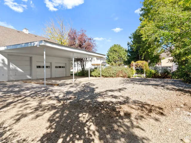 Great location for a future pool behind the detached garage, which features pull through doors on both sides.