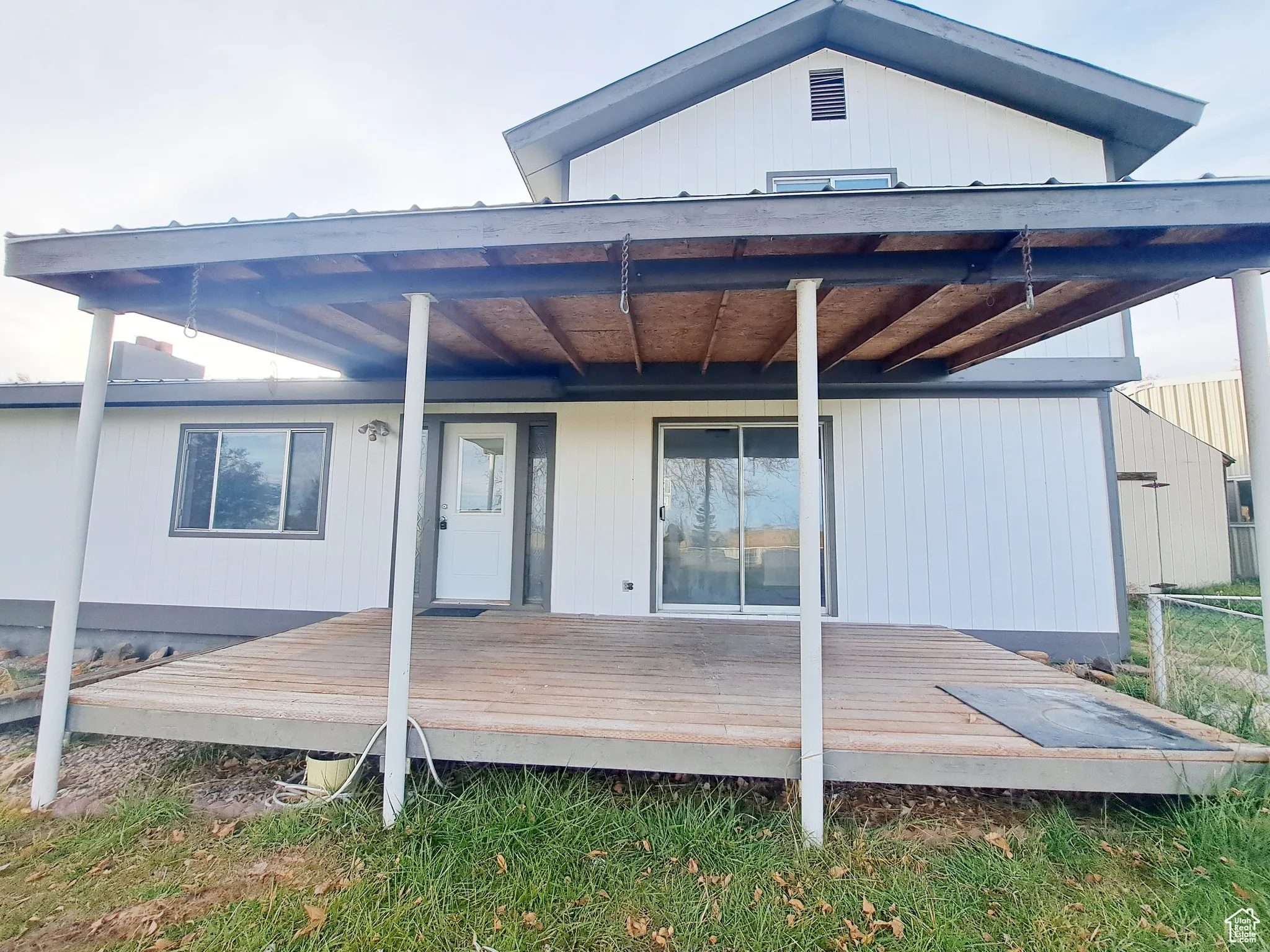Front view of house featuring a Large Welcoming deck to Watch the Gorgeous Views.