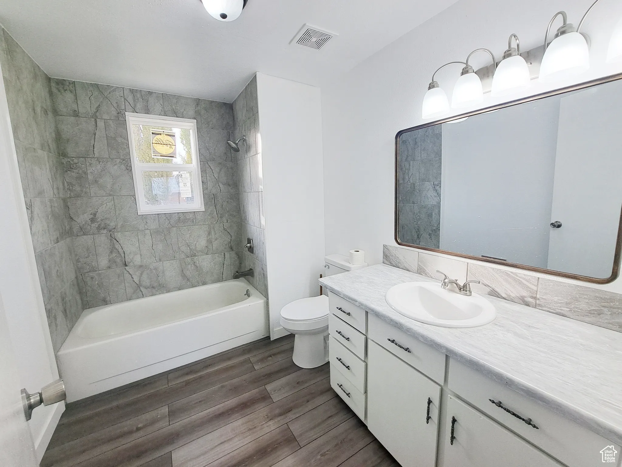 Full bathroom, New Paint, New Ceiling Fan, New tiled shower / bath, New toilet,  New vanity, New Lighting, New Countertops