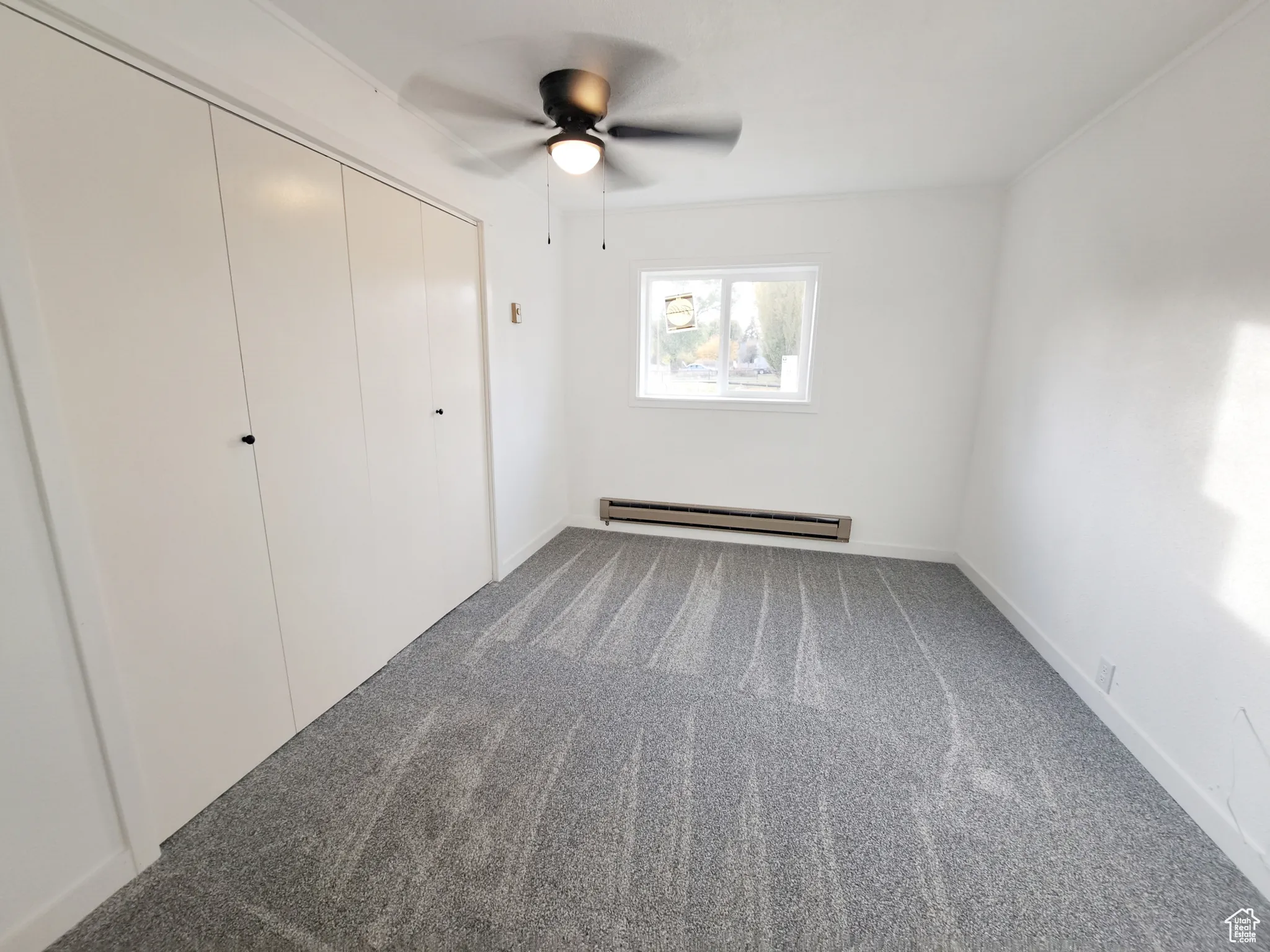Bedroom 2, New Carpet, New Paint, New Ceiling Fan, and a baseboard heating unit