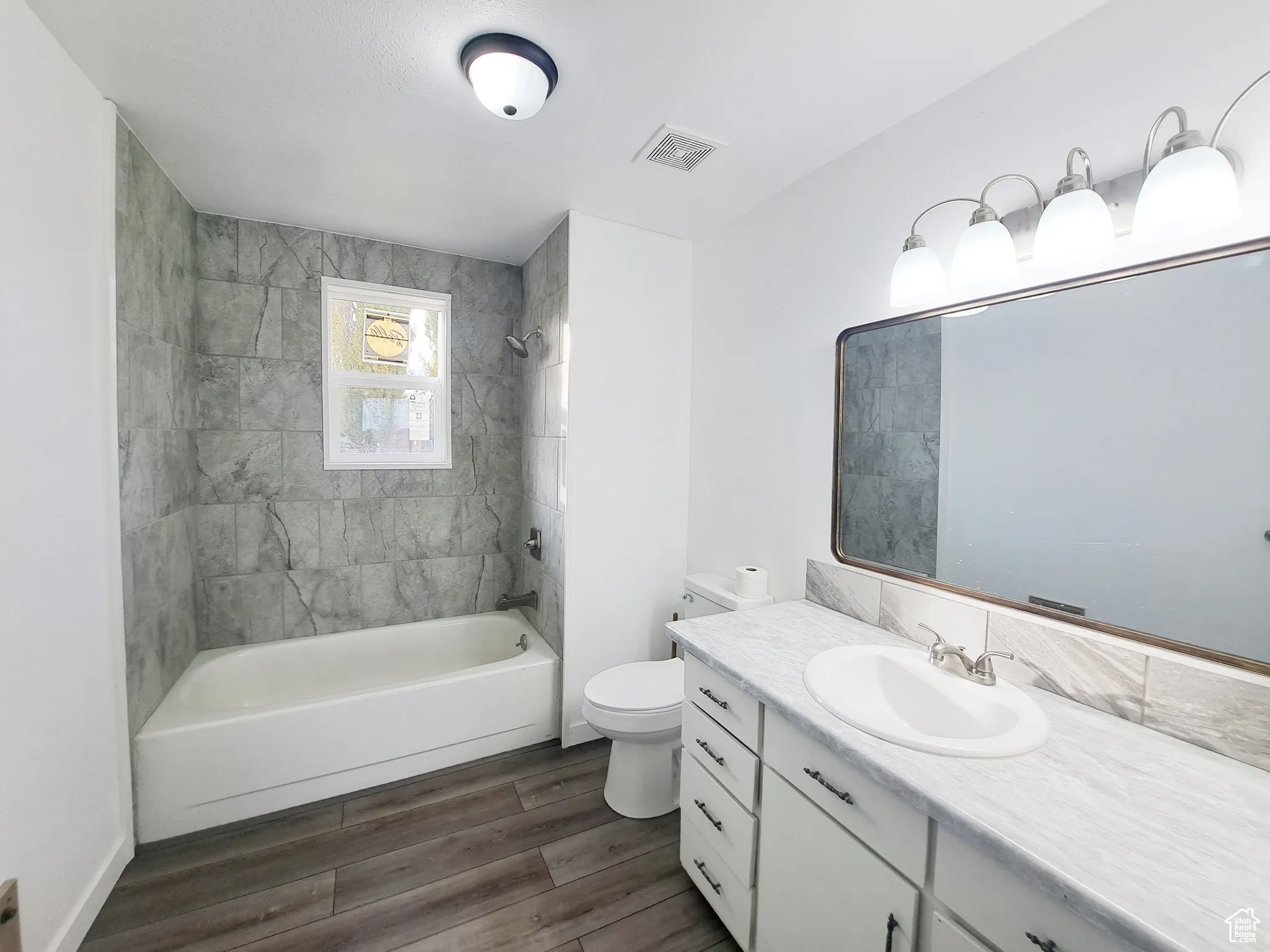 Full bathroom, New Paint, New Ceiling Fan, New tiled shower / bath, New toilet,  New vanity, New Lighting, New Countertops