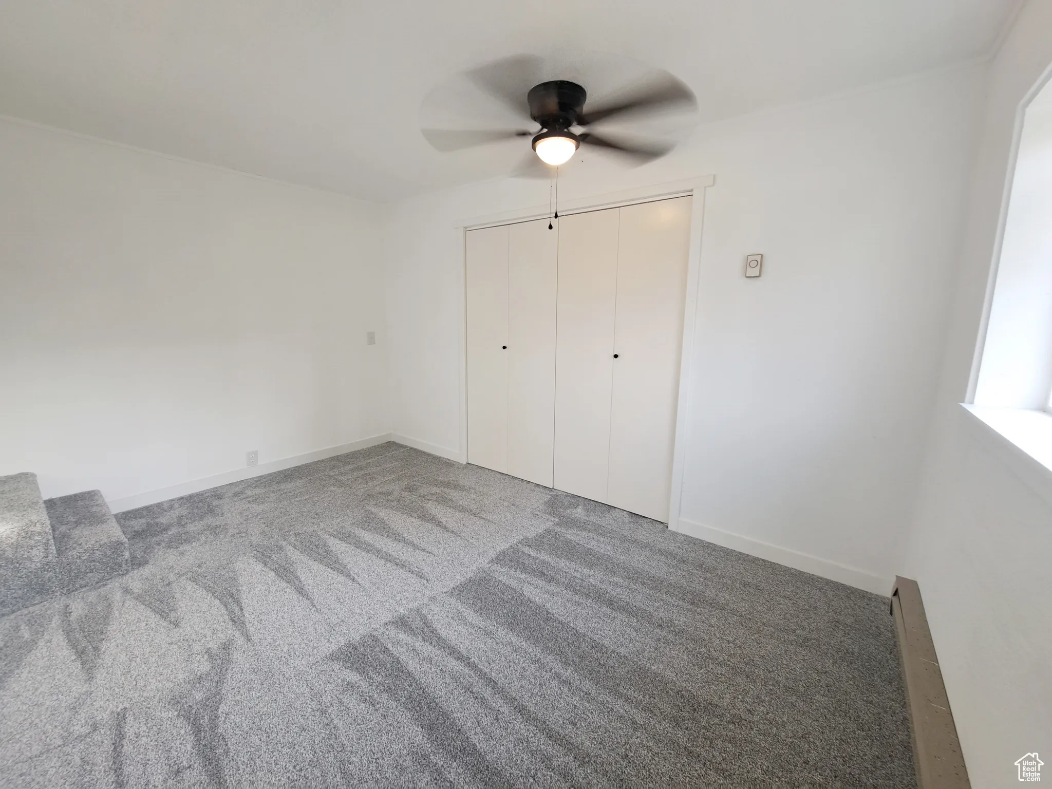 Bedroom 2, with a closet, New ceiling fan, and New carpet floors, New Paint