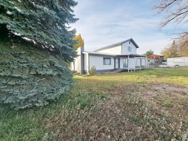 Exterior space featuring a yard