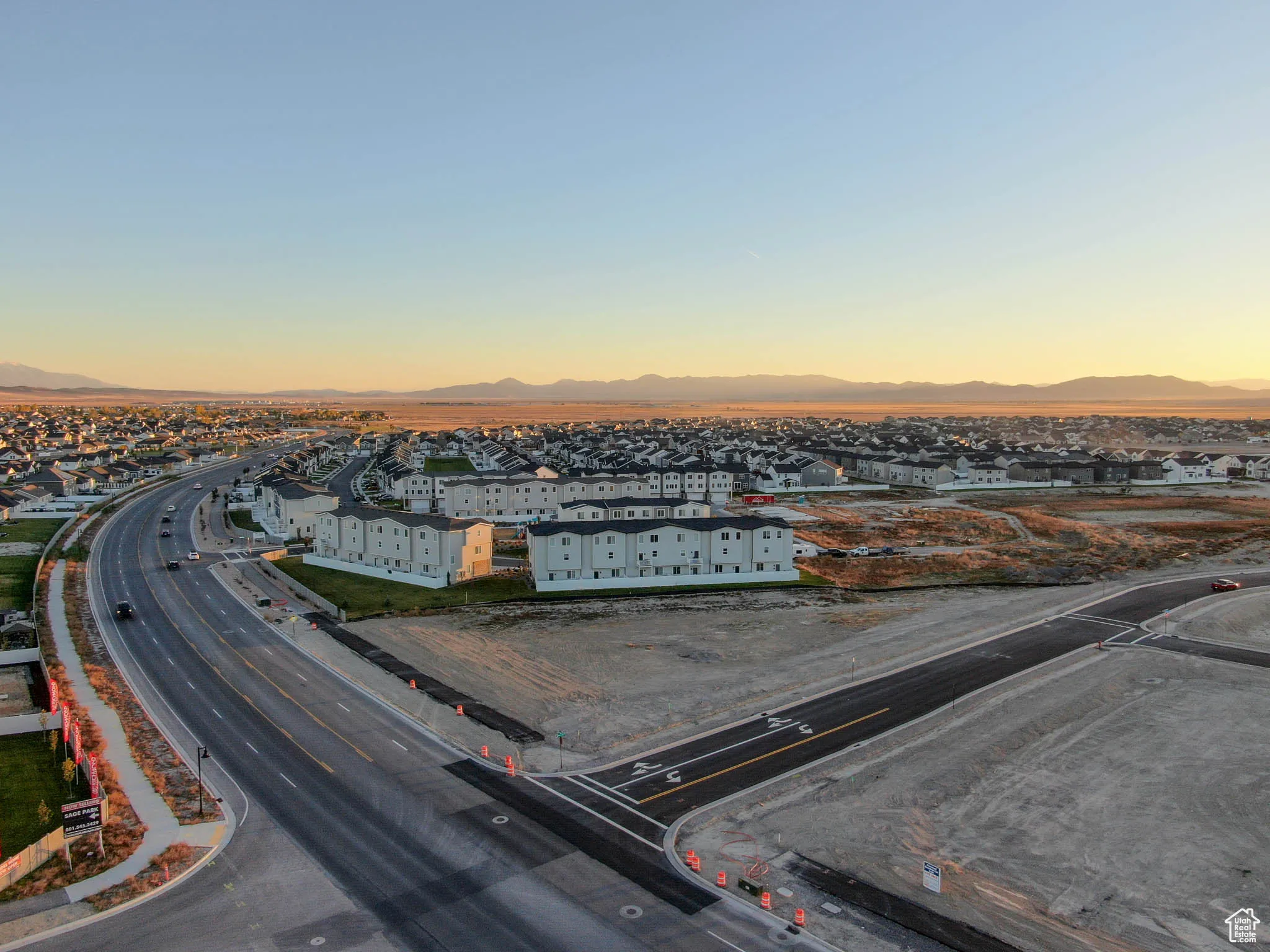 Aerial view at dusk featuring a mountain view