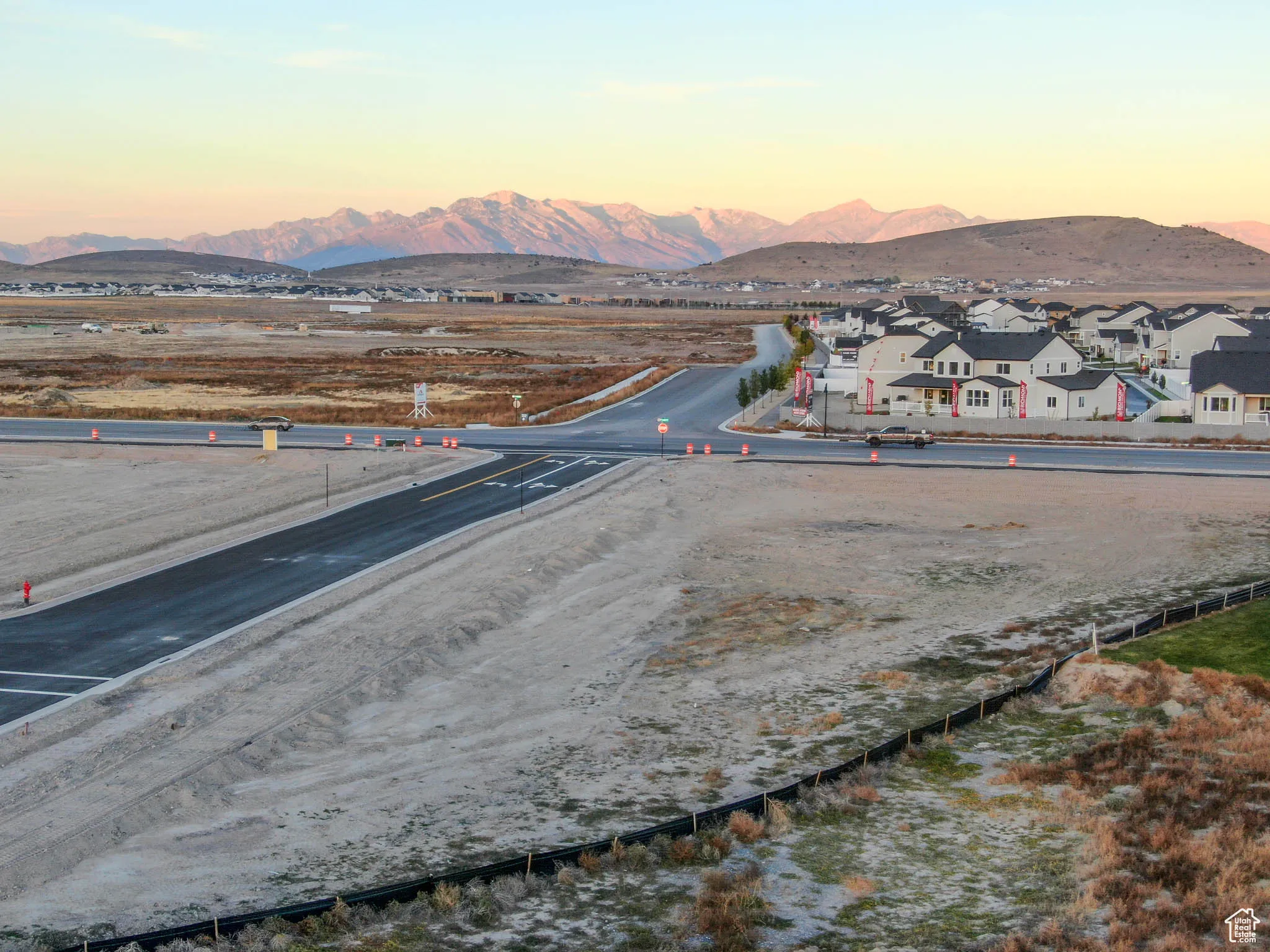Aerial view at dusk featuring a mountain view
