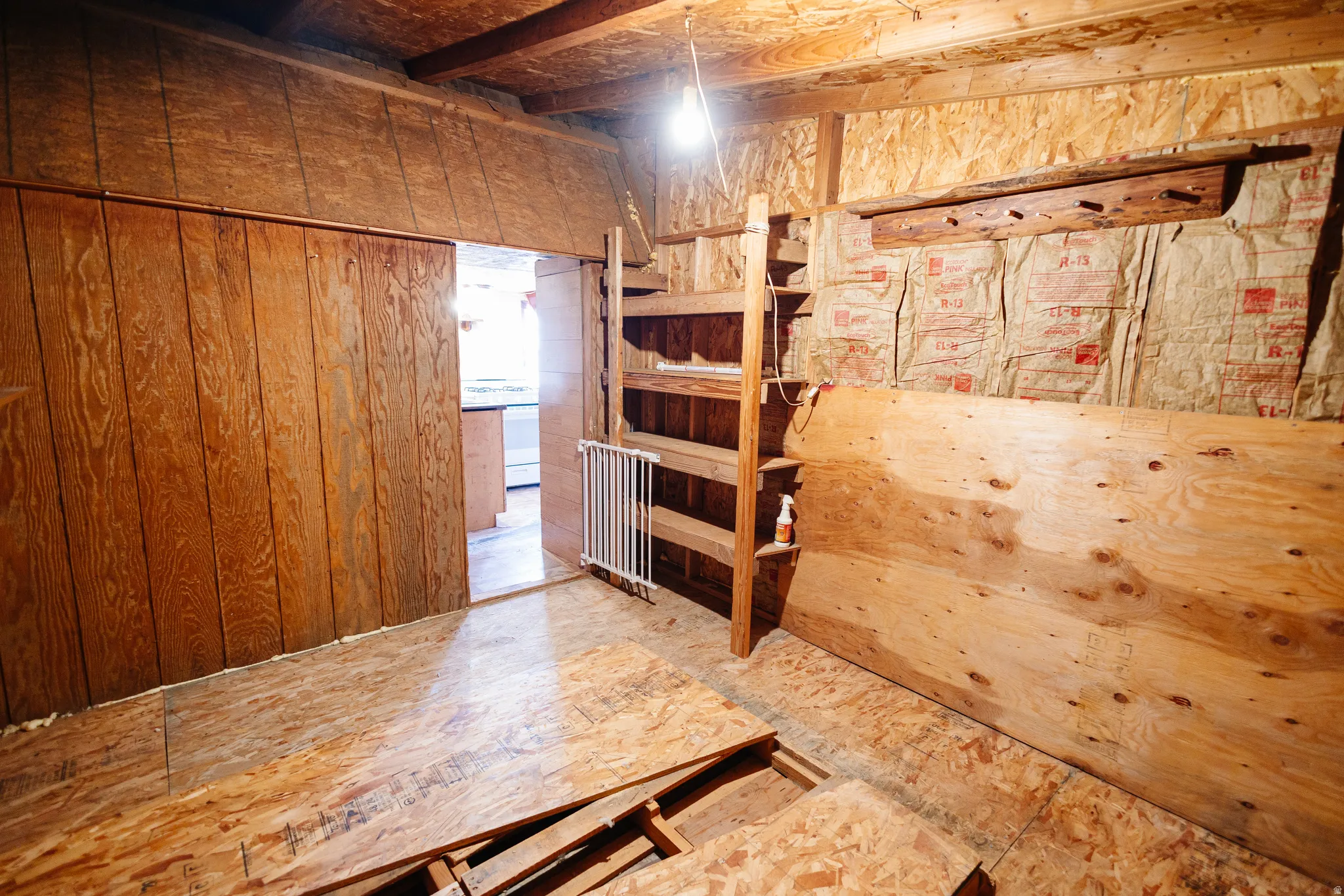 Unfurnished bedroom with wooden walls