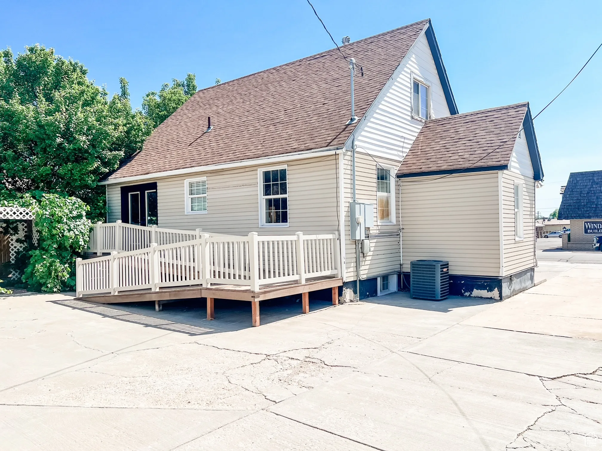 Rear view of property featuring ADA compliant wheelchair ramp