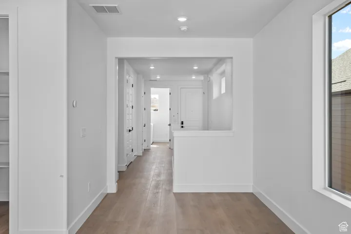Hallway featuring light hardwood / wood-style floors