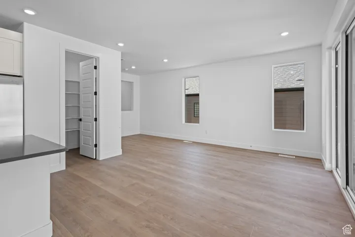 Unfurnished living room featuring light hardwood / wood-style floors
