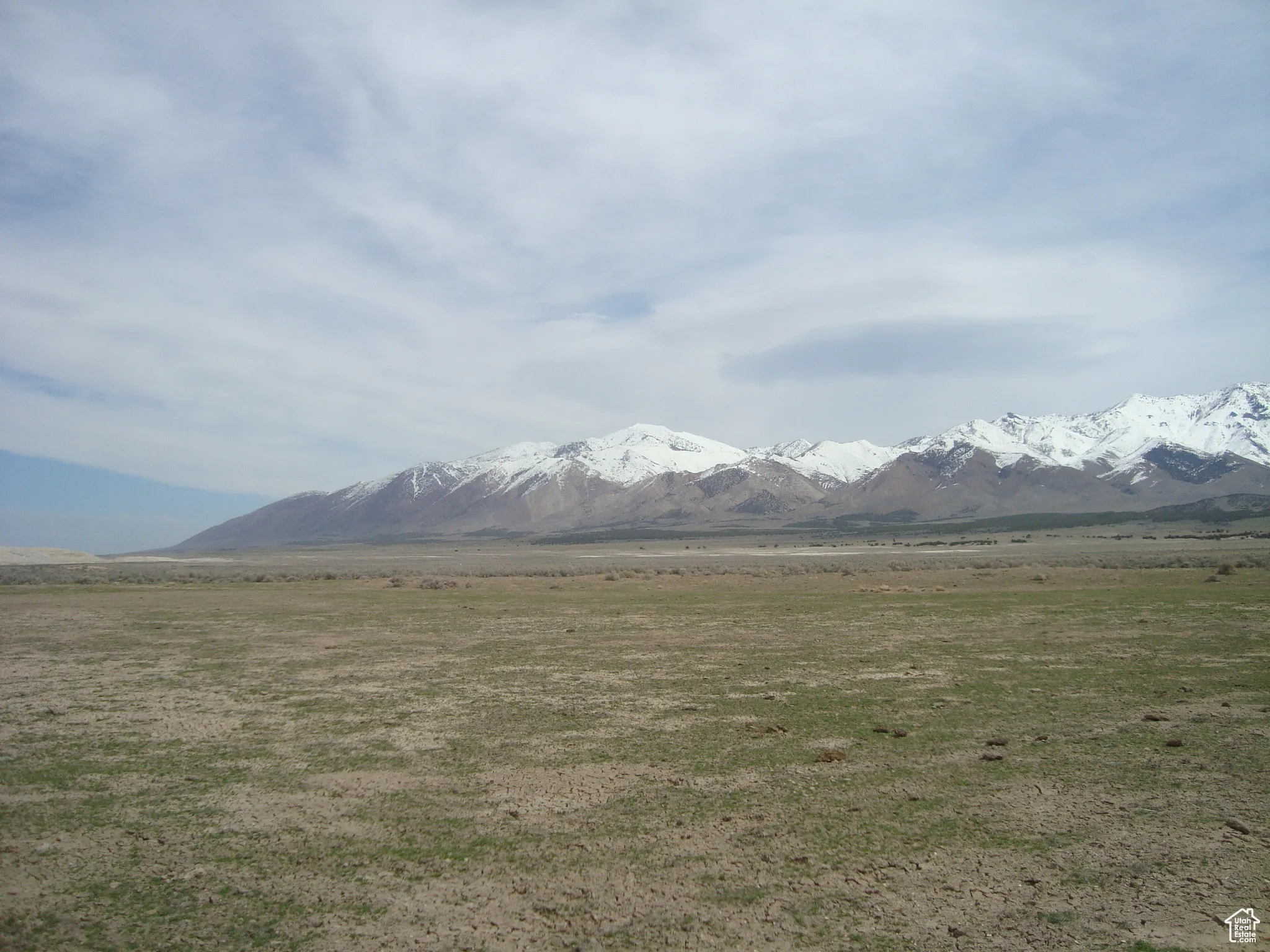 Property view of mountains with a rural view