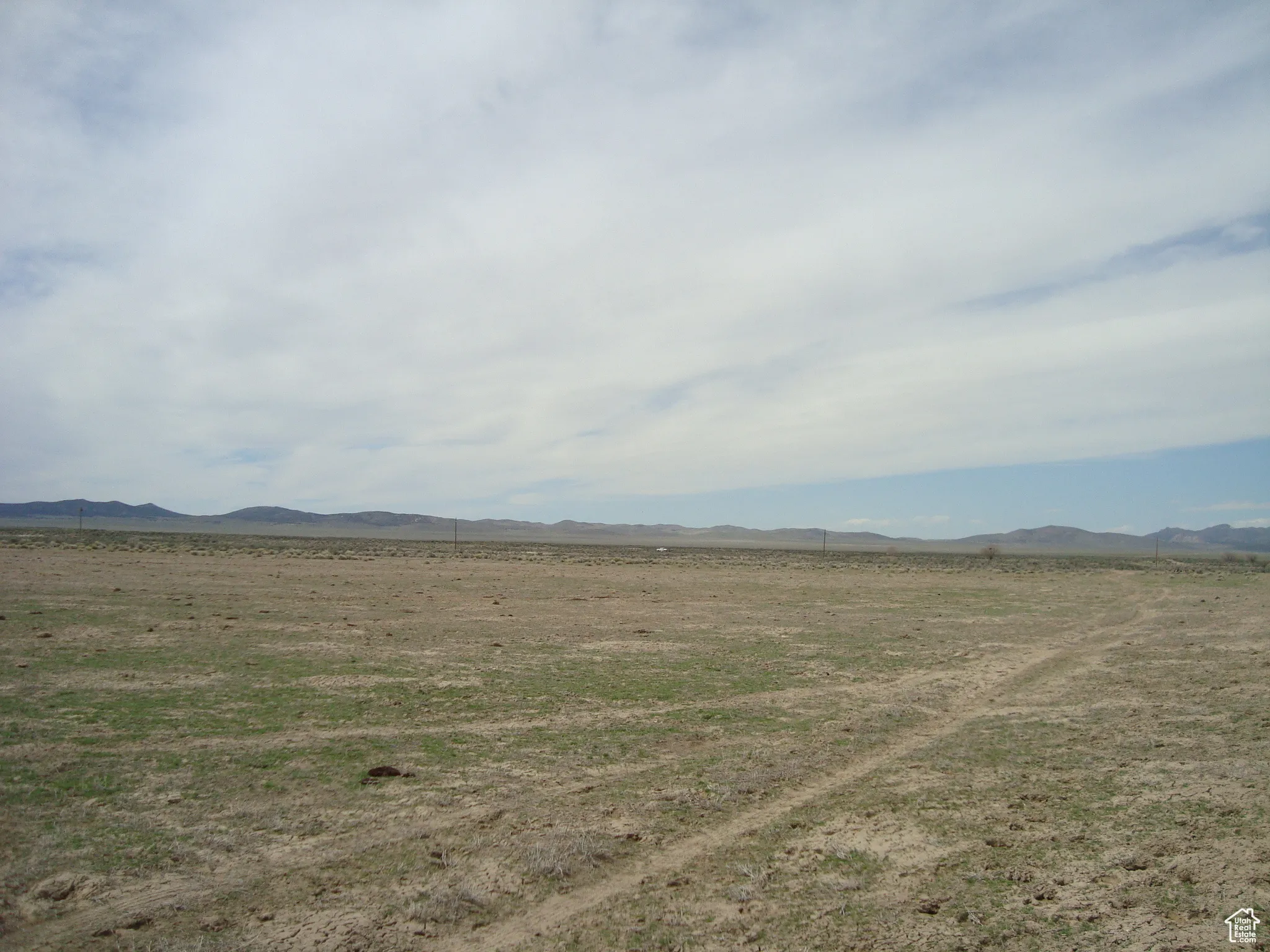 Property view of mountains with a rural view