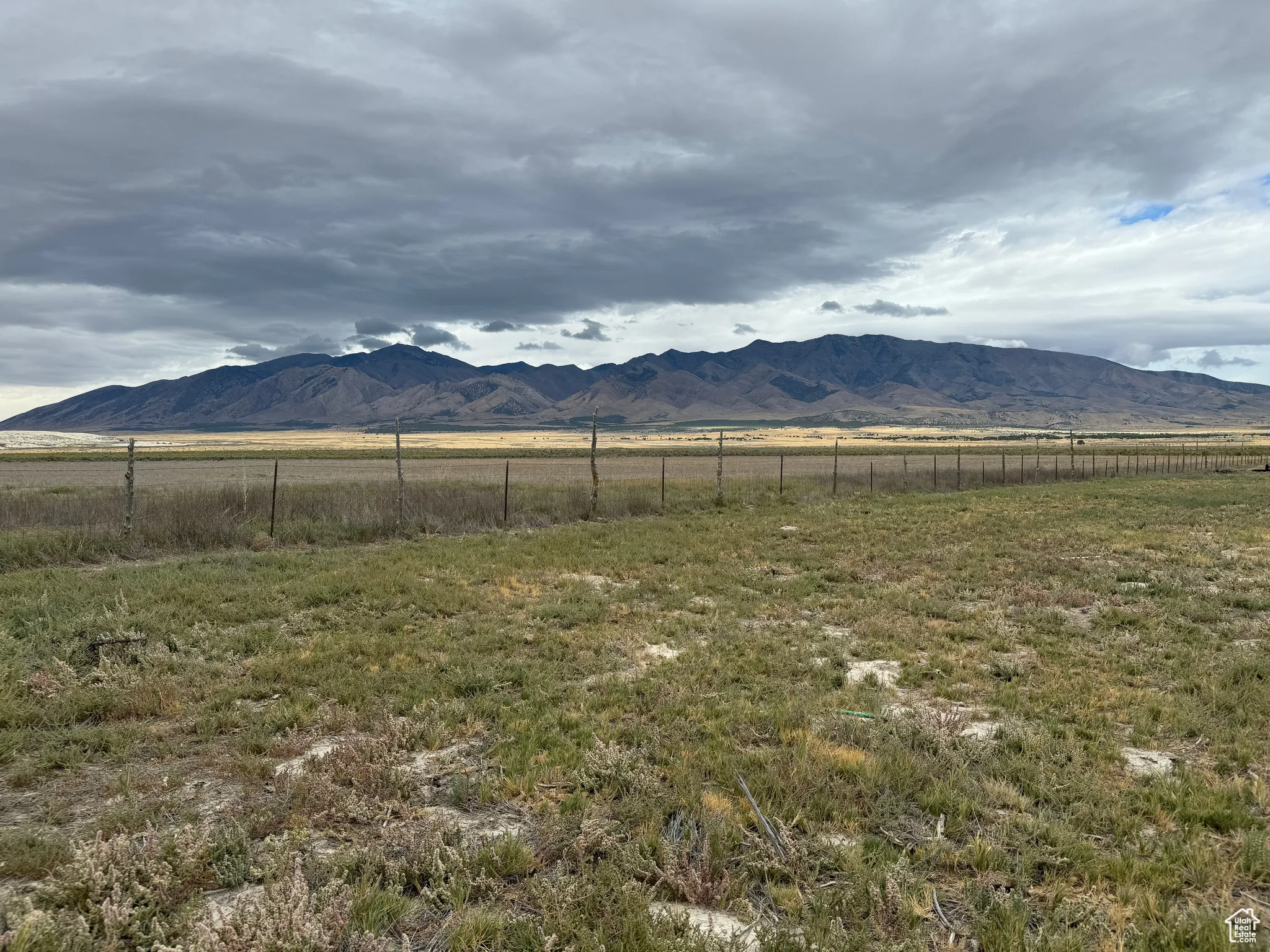 Property view of mountains with a rural view