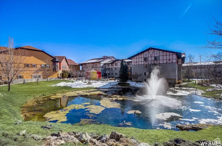 View of home's community featuring a yard