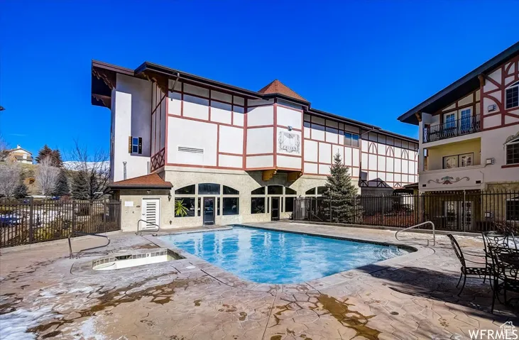 View of swimming pool with a patio