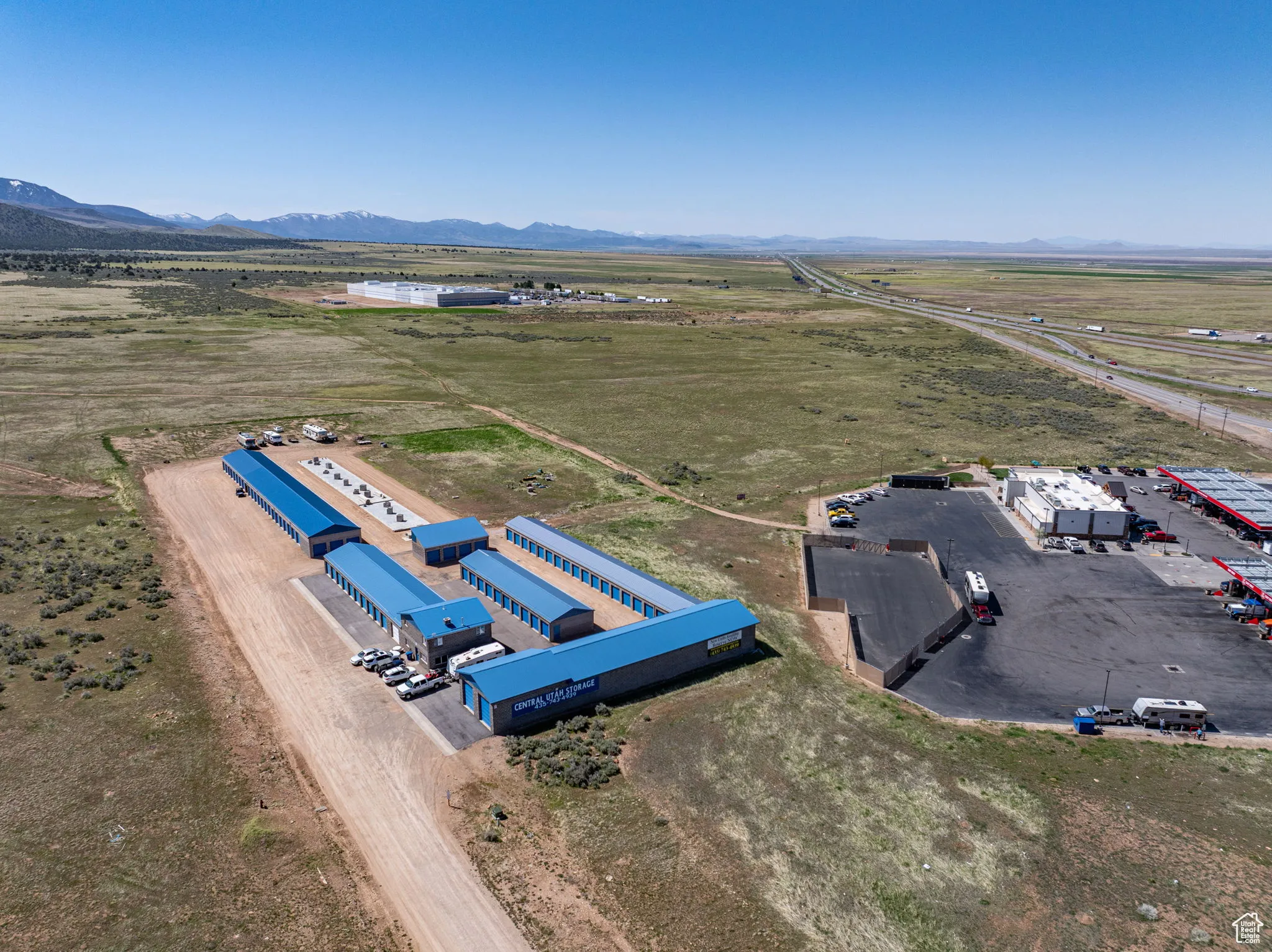 Overview of rural landscape featuring a mountainous background