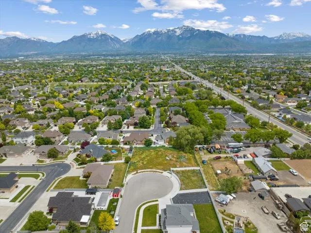 Birds eye view of property with a mountain view