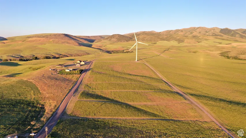 Drone / aerial view with a mountain view and a rural view