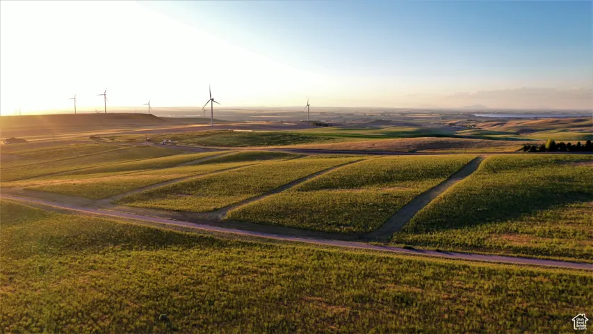 Aerial view at dusk featuring a rural view