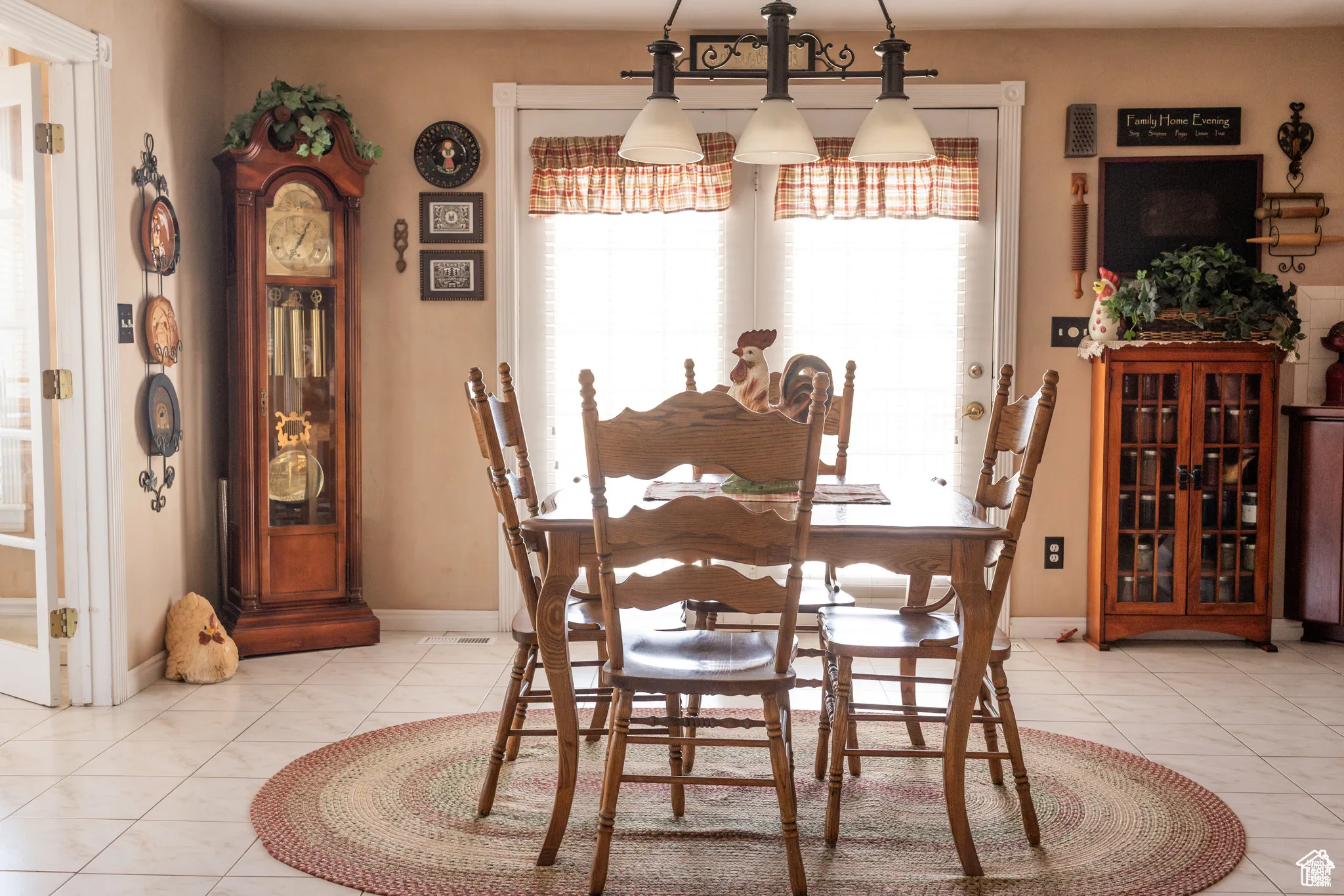 Dining area with light tile patterned floors