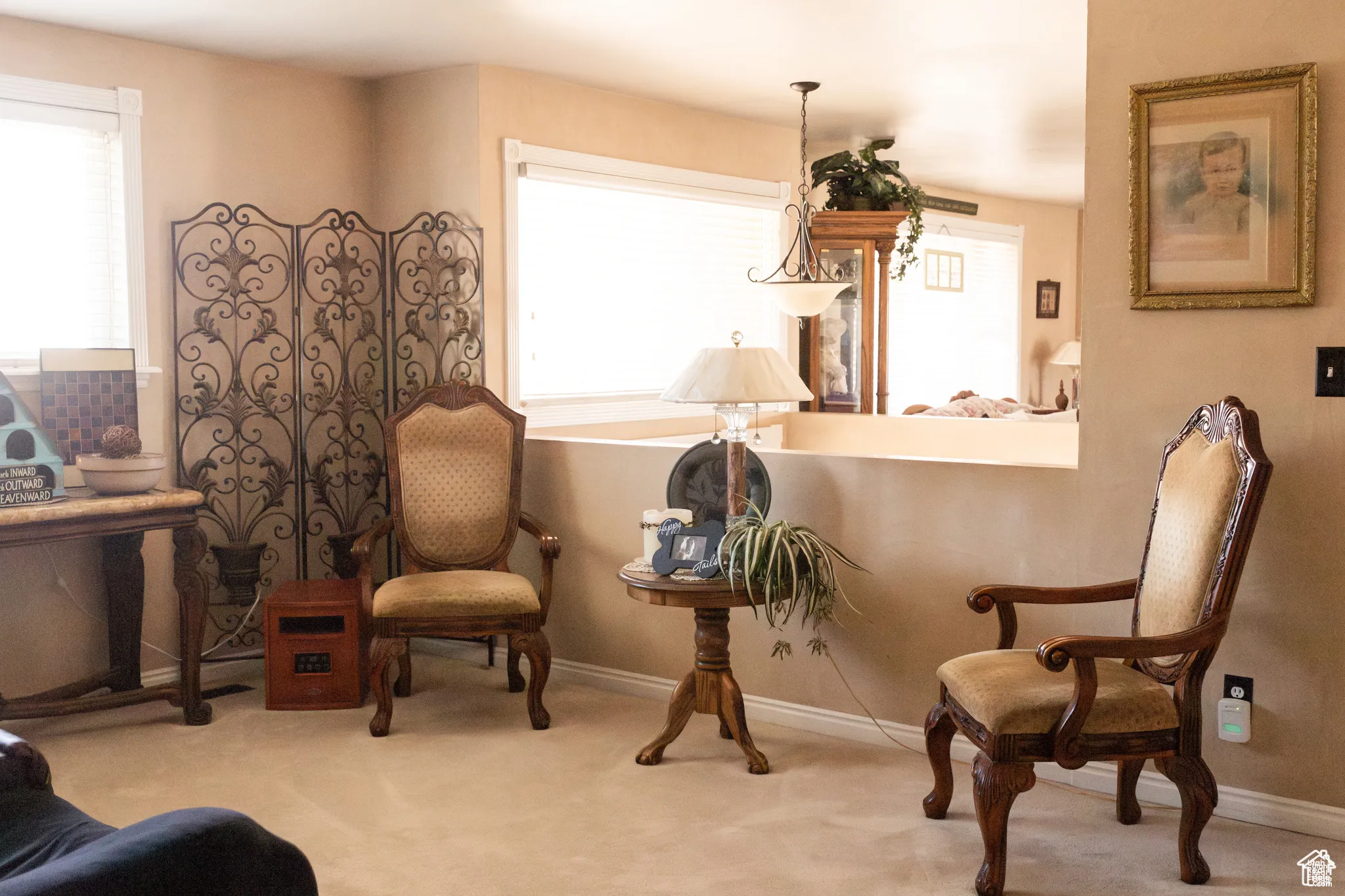 Sitting room featuring light colored carpet
