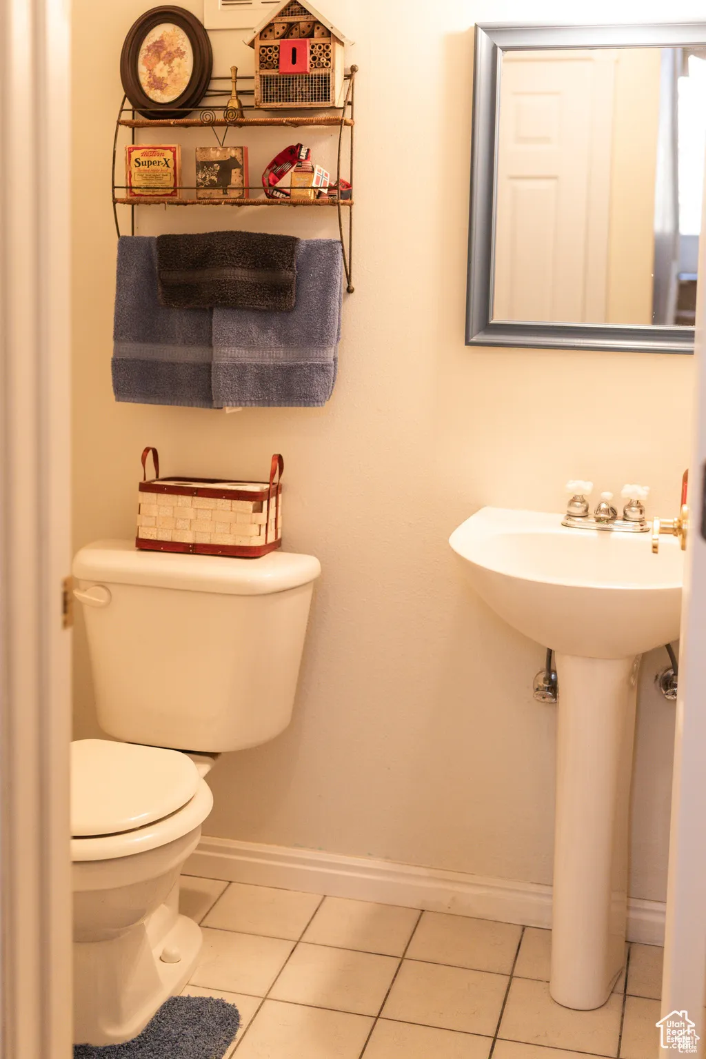 Bathroom featuring toilet and tile patterned floors