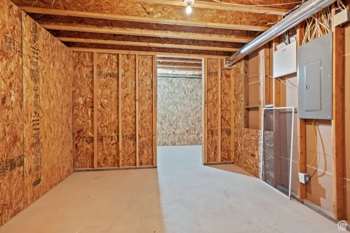 Unfinished below grade area with electric panel