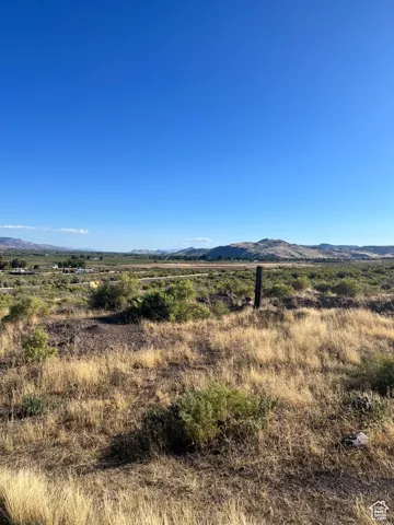 Property view of mountains with a rural view