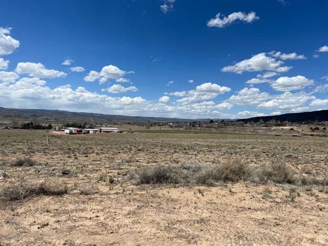 Property view of mountains with a rural view