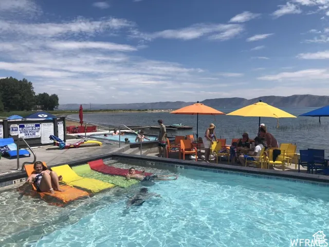 View of pool featuring a water and mountain view