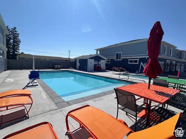 View of swimming pool with a patio area
