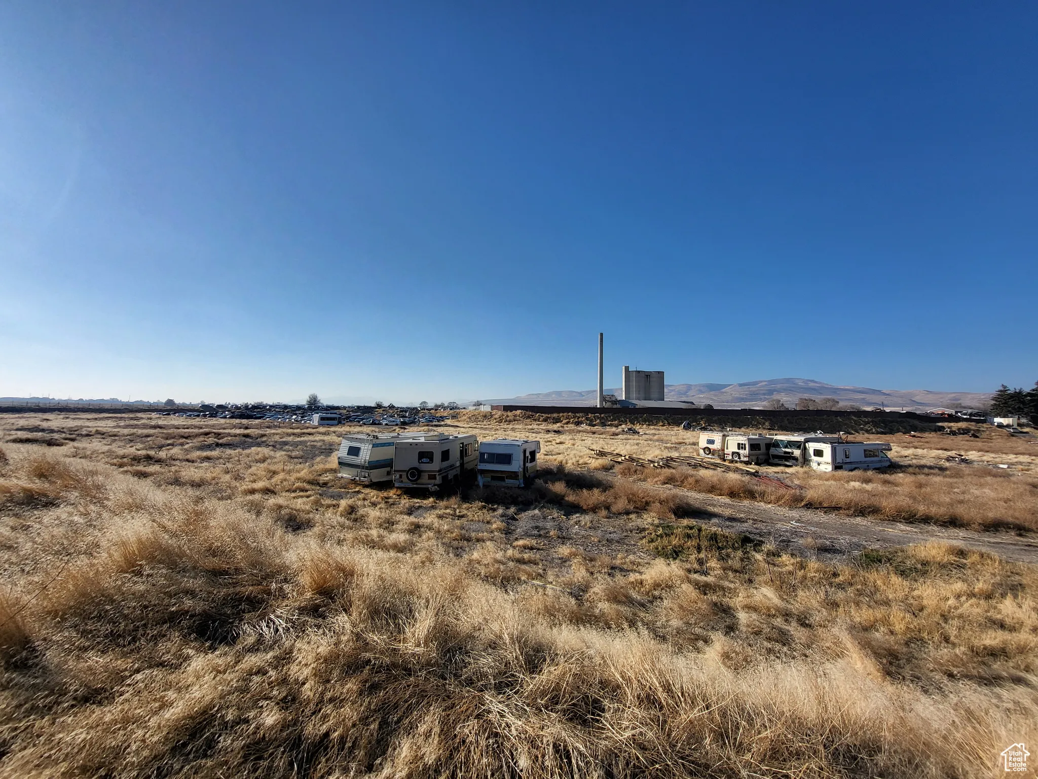 View of yard featuring a mountain view, a rural view, and central air condition unit