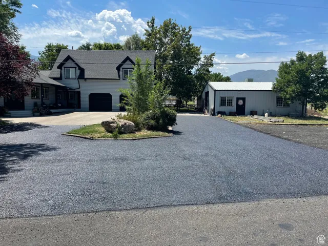View of front of house featuring a mountain view and a garage