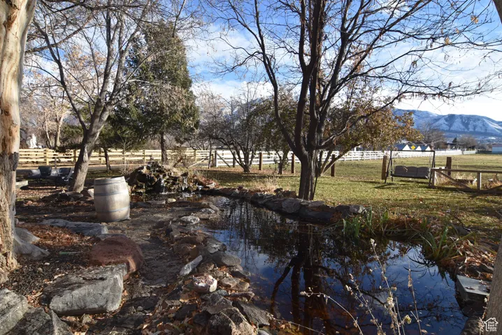 View of yard featuring a mountain view and a rural view