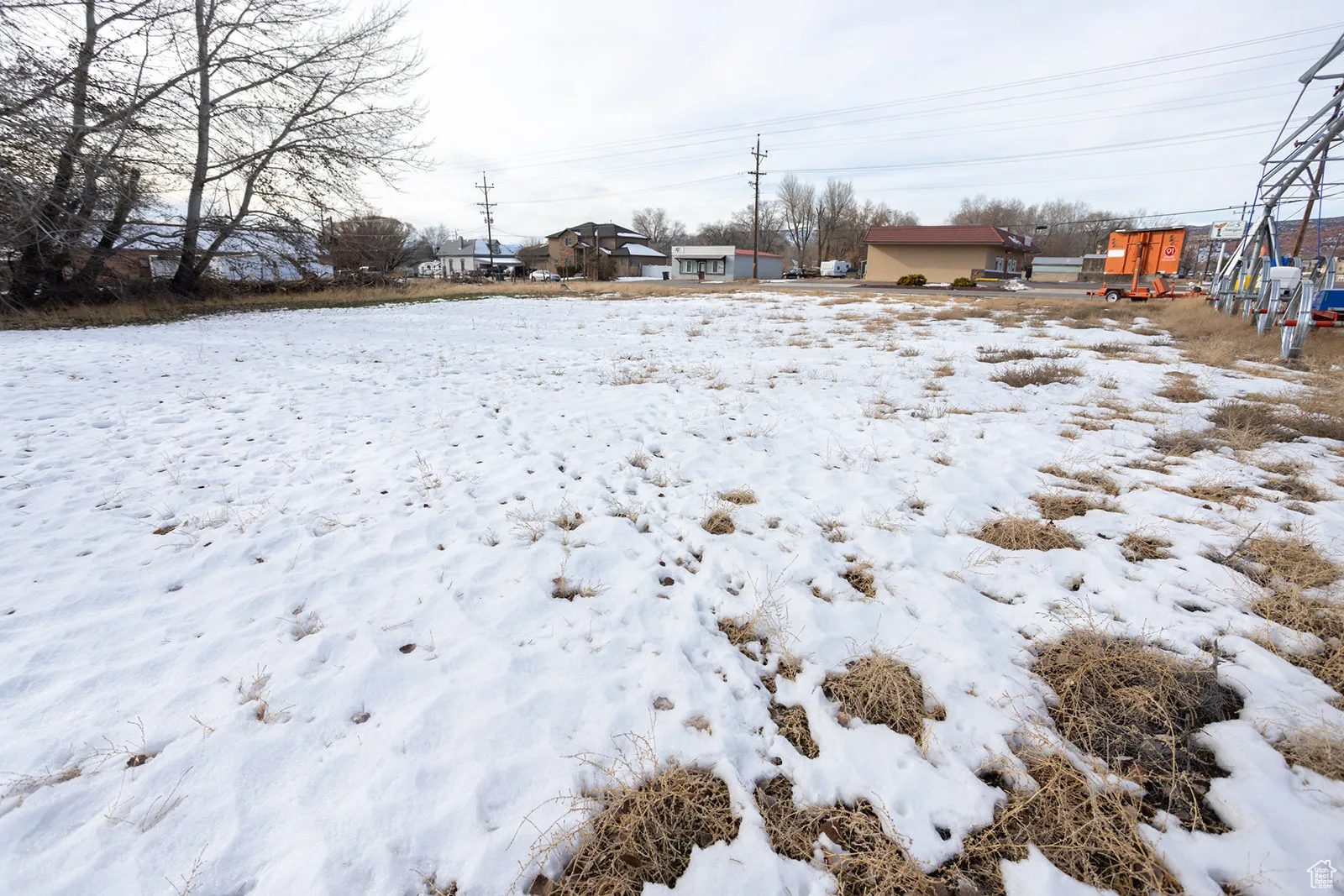 View of yard layered in snow