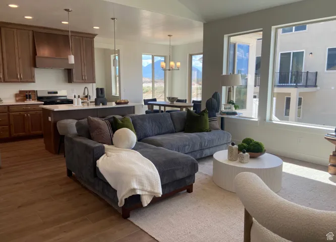 Living room featuring a chandelier and dark hardwood / wood-style floors