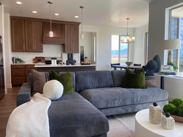 Living room featuring hardwood / wood-style flooring and a chandelier